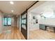 Basement hallway with sliding barn door and hardwood floors at 4373 Wieuca Ne Rd, Atlanta, GA 30342