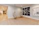 Finished basement recreation room with built-in shelving and hanging chairs at 4373 Wieuca Ne Rd, Atlanta, GA 30342