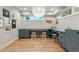 Bright basement study with L-shaped desks and large light fixture at 4373 Wieuca Ne Rd, Atlanta, GA 30342