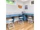 Bright craft room with blue built-in desks and white stools at 4373 Wieuca Ne Rd, Atlanta, GA 30342