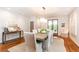 Modern dining room with hardwood floors, a wooden table, and access to the outdoors at 4373 Wieuca Ne Rd, Atlanta, GA 30342