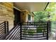 Inviting front porch with stone wall and metal railing at 4373 Wieuca Ne Rd, Atlanta, GA 30342