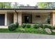 Contemporary home with stone accents and manicured landscaping at 4373 Wieuca Ne Rd, Atlanta, GA 30342