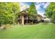 Contemporary house with stone accents and a spacious lawn at 4373 Wieuca Ne Rd, Atlanta, GA 30342