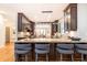 Island kitchen with dark cabinetry and breakfast bar at 4373 Wieuca Ne Rd, Atlanta, GA 30342