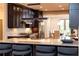 Modern kitchen featuring island seating and dark cabinetry at 4373 Wieuca Ne Rd, Atlanta, GA 30342