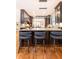 Island kitchen with dark cabinetry and breakfast bar at 4373 Wieuca Ne Rd, Atlanta, GA 30342