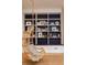 Built-in shelves and hanging chair in the playroom at 4373 Wieuca Ne Rd, Atlanta, GA 30342