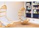 Bright playroom with hanging chairs and built-in shelves at 4373 Wieuca Ne Rd, Atlanta, GA 30342