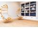 Charming playroom with built-in shelving and hanging chairs at 4373 Wieuca Ne Rd, Atlanta, GA 30342