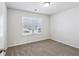 Bright bedroom with carpeted floor and large window at 585 Mcwilliams Se Rd # 807, Atlanta, GA 30315