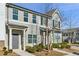 Two-story townhome with gray and white siding, landscaping, and a gray front door at 585 Mcwilliams Se Rd # 807, Atlanta, GA 30315