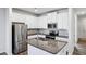 Modern kitchen with white cabinets, granite countertops, and stainless steel appliances at 585 Mcwilliams Se Rd # 807, Atlanta, GA 30315