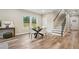 Bright dining room with glass table and four chairs, near staircase at 1330 Sw Adams Dr, Atlanta, GA 30311