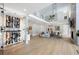 Two-story living room with a wine cellar, hardwood floors and modern fireplace at 205 Slaton Cir, Roswell, GA 30075