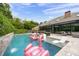 Inviting pool area with lounge chairs and fun flamingo floats at 205 Slaton Cir, Roswell, GA 30075