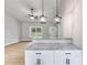 Kitchen island with granite countertop and modern pendant lighting at Tract1 Harmony Rd, Temple, GA 30179