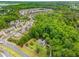 Aerial view showing a house nestled in a wooded neighborhood at 4107 Old Suwanee Rd, Buford, GA 30518