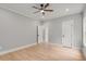 Spacious bedroom with hardwood floors and neutral-toned walls at 4107 Old Suwanee Rd, Buford, GA 30518