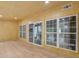 Sunroom with wood walls, hardwood floors, and plenty of natural light at 4107 Old Suwanee Rd, Buford, GA 30518