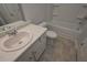 Bathroom with tub, toilet, and vanity at 477 Charleston Pl, Villa Rica, GA 30180