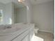 Bathroom with double vanity, marble countertop, and tile floor at 477 Charleston Pl, Villa Rica, GA 30180