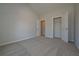 Spacious bedroom with a large closet and carpet flooring at 477 Charleston Pl, Villa Rica, GA 30180