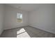 Well-lit bedroom with carpet and neutral walls at 477 Charleston Pl, Villa Rica, GA 30180