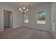 Bright dining room with hardwood floors and chandelier at 477 Charleston Pl, Villa Rica, GA 30180