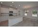 Modern kitchen with island and hardwood floors at 477 Charleston Pl, Villa Rica, GA 30180