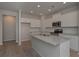 Modern kitchen with island and hardwood floors at 477 Charleston Pl, Villa Rica, GA 30180