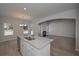 Kitchen island with granite countertop and stainless steel appliances at 477 Charleston Pl, Villa Rica, GA 30180