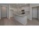 Modern kitchen with island and hardwood floors at 477 Charleston Pl, Villa Rica, GA 30180