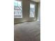 Bright bedroom with neutral carpet and natural light from large windows at 1250 Winterhaven Dr, Cumming, GA 30041