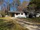 Ranch home with carport and mature trees at 2030 Sanders Dr, Austell, GA 30168