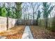 Private backyard with wooden fence and gate at 2106 Childress Sw Dr, Atlanta, GA 30311