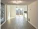 Open concept dining area with hardwood floors and sliding glass doors at 2106 Childress Sw Dr, Atlanta, GA 30311