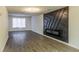 Living room features hardwood floors and a modern fireplace feature wall at 2106 Childress Sw Dr, Atlanta, GA 30311