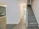 Gray carpeting on stairs, light gray walls, and wood-look flooring at 2106 Childress Sw Dr, Atlanta, GA 30311