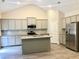 Modern kitchen with stainless steel appliances and granite countertops at 475 Charleston Pl, Villa Rica, GA 30180