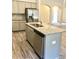 Kitchen island with granite countertop and sink at 475 Charleston Pl, Villa Rica, GA 30180