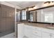 Bright bathroom featuring a walk-in shower with gray subway tile and a double vanity with granite countertops at 770 Grove Bnd, Decatur, GA 30030