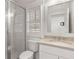 Bright bathroom with a glass-enclosed shower and a vanity with a neutral countertop at 770 Grove Bnd, Decatur, GA 30030