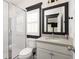 Clean bathroom with white vanity, shower, and black trim at 770 Grove Bnd, Decatur, GA 30030