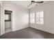 Bright bedroom featuring dark wood floors, a ceiling fan, and natural light from the window at 770 Grove Bnd, Decatur, GA 30030