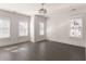 Bedroom featuring dark wood floors and natural light from multiple windows with white trim at 770 Grove Bnd, Decatur, GA 30030