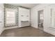 Bedroom featuring built-in Murphy bed with a pull-down desk, with connecting ensuite bath at 770 Grove Bnd, Decatur, GA 30030