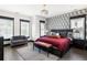 Main bedroom with a king bed, dark wood furniture, and a maroon quilt at 770 Grove Bnd, Decatur, GA 30030