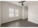 Bright bedroom featuring dark wood floors, a ceiling fan, and natural light from the window at 770 Grove Bnd, Decatur, GA 30030