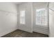 Walk-in closet featuring wood floors, neutral paint, natural light from the windows, and wire shelves at 770 Grove Bnd, Decatur, GA 30030